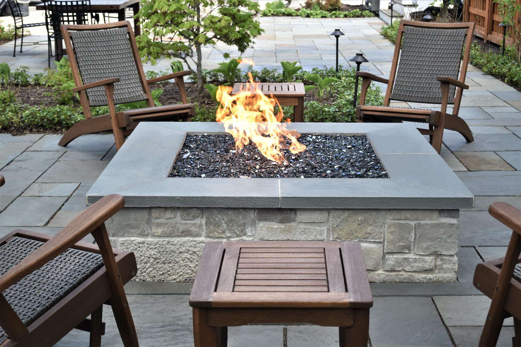 Outdoor Fireplace vs. Fire Pit Choosing What’s Best For Your Landscape